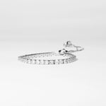 The Adjustable White Tennis Bracelet is a timeless piece crafted from fine silver and dazzling zircon stones. Its classic design shines with brilliant white sparkle, adding elegance to any look.