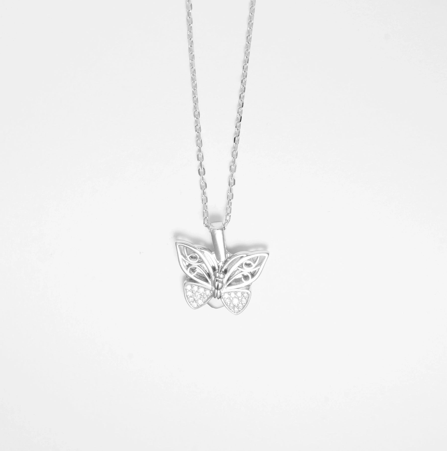 The Butterfly Hidden Heart Necklace is a beautifully crafted fine silver piece with sparkling zircon stones. What makes it truly special is its unique design; the butterfly’s wings unfold to reveal a hidden heart inside, perfect for engraving a personal message.