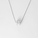 The Crystal Cylinder Necklace is a sleek and modern piece crafted from fine silver, adorned with dazzling bright zircon stones arranged in a unique cylindrical design. Its clean lines and sparkling details make it a versatile accessory that effortlessly elevates any outfit.