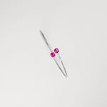 Deep red crystals paired with shining stones on sleek silver. The stunning red glow creates a warm, luxurious accent that complements any outfit, making it the perfect statement piece for both everyday wear and special occasions.