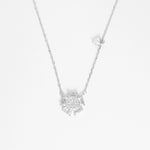 The Floral Cluster Necklace is a stunning blend of fine silver and brightening zircon stones, designed to capture the delicate beauty of a blooming flower.