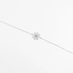 Delicate yet dazzling, the Floral Twist Bracelet blooms with charm. Its elegant flower-shaped design is brought to life with brightening zircon stones and shimmering crystals, all set in pure silver.