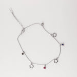 Fresh, fun, and full of summer charm the Flower Gem Anklet brings playful vibes to your sunny days. Made from fine silver, this anklet features dainty flower outlines and colorful mini stones in pink, black, blue, and clear tones.