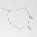 Celebrate endless summer days with the Infinity Pearl Anklet. Made from fine silver, this delicate anklet features elegant infinity charms—one accented with shimmering stones—paired with soft silver beads.