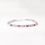 Add a pop of color with the Pink Accent Tennis Bracelet, crafted from fine silver and sparkling zircon stones. This elegant bracelet features shimmering clear stones accented by vibrant pink zircons, making it a perfect blend of classic and playful style.