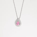 The Pink Drop Stone Necklace is a stunning piece that radiates soft elegance and feminine charm. Crafted from fine silver and surrounded by sparkling zircon stones, its delicate pink centerpiece captures the light beautifully.