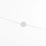 The Radiant Circle Bracelet features a beautifully crafted round charm filled with bright zircon stones and delicate crystals.