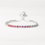 Brighten your look with the Rainbow Adjustable Tennis Bracelet. Crafted from fine silver and sparkling zircon stones in a beautiful spectrum of colors, this bracelet adds a playful yet elegant touch to any outfit.