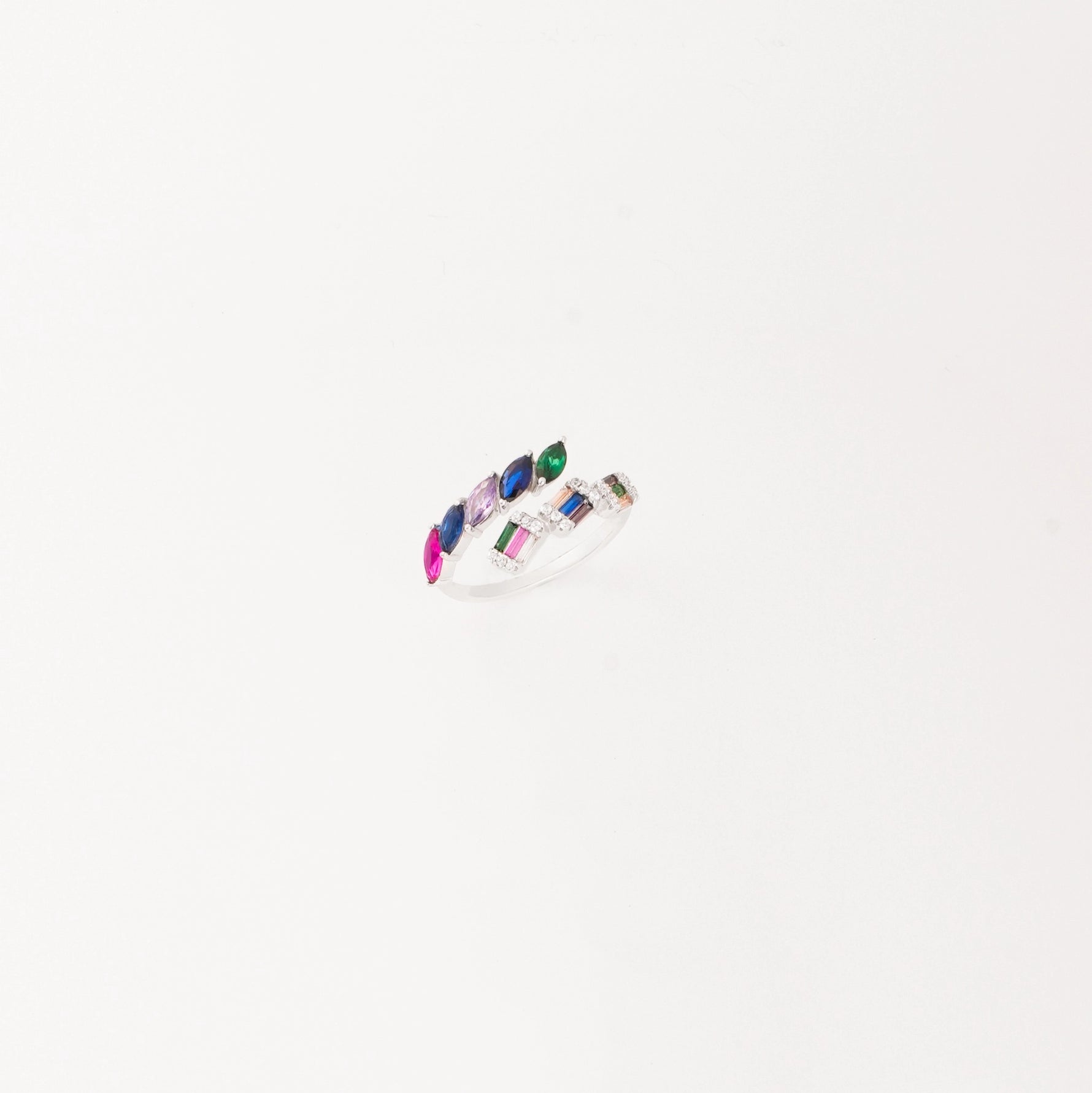 Crafted from premium silver, it features vibrant, multicolored stones arranged in a playful, open design