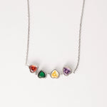 Discover the charm of the Rainbow Hearts Necklace, crafted from fine silver. This unique design offers two beautiful looks in one—wear it as a single row of vibrant hearts or transform it into a compact cluster.