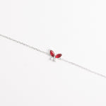 The Red Leaf Bracelet features two vibrant marquise-cut red stones shaped like delicate leaves, paired with shimmering zircon crystals.