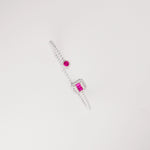 the Red Radiance Illusion Silver Bangle meets elegance with bold beauty. Featuring a striking red crystal stone framed by shimmering white zircons, this band design adds a touch of modern glam to your wrist.