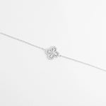 The Sparkly Clover Bracelet features a charming clover design made of pear-shaped zircon stones, surrounded by delicate crystal accents.