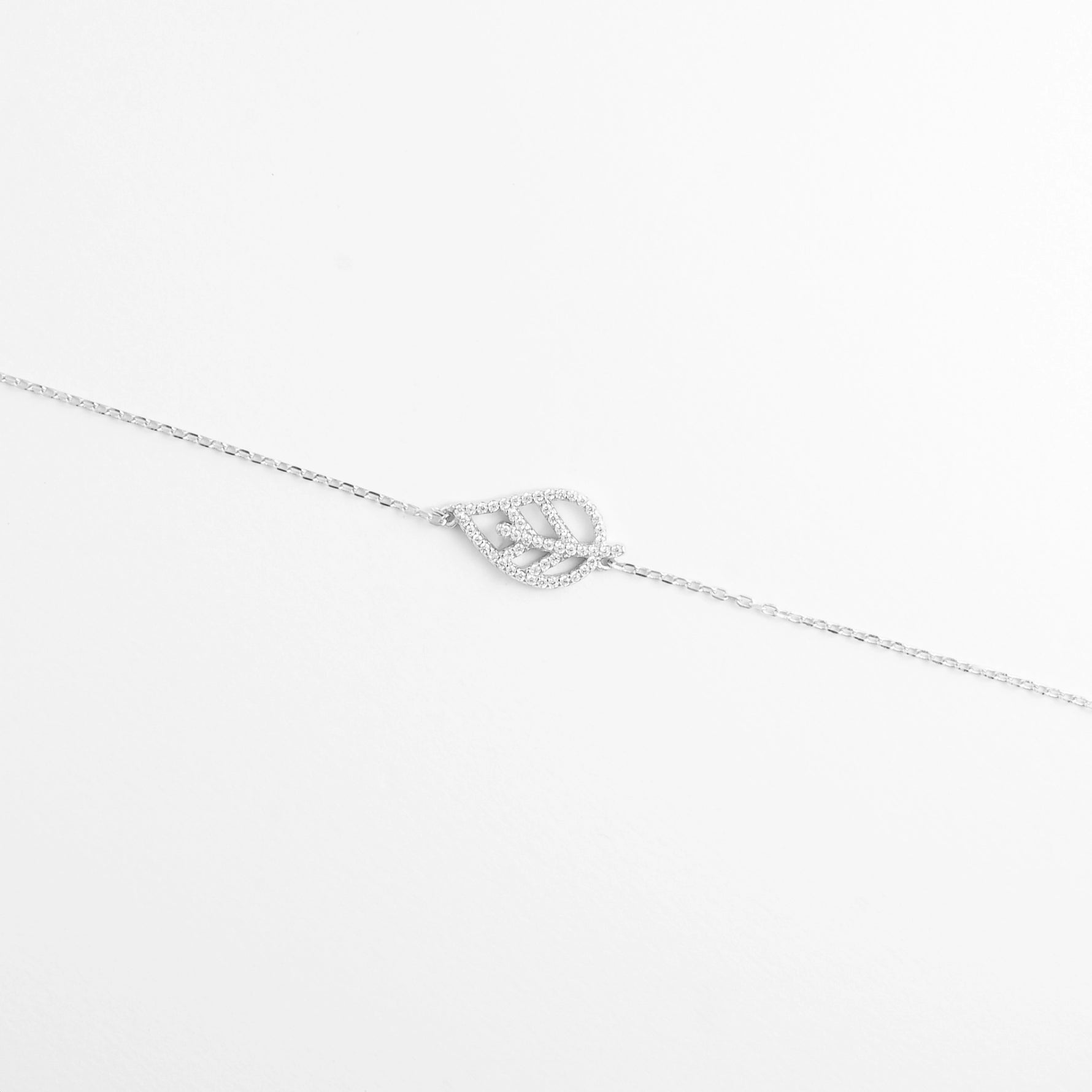 The Leaf Shine Bracelet features a graceful open-leaf design, outlined with bright zircon stones.