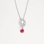 The Twilight Crystal Necklace captures the beauty of light and color in one elegant piece. Set in pure silver, its double halo sparkles with bright zircon stones, gently circling a magical crystal that shifts between pink, yellow, and clear tones—like twilight dancing on your skin.