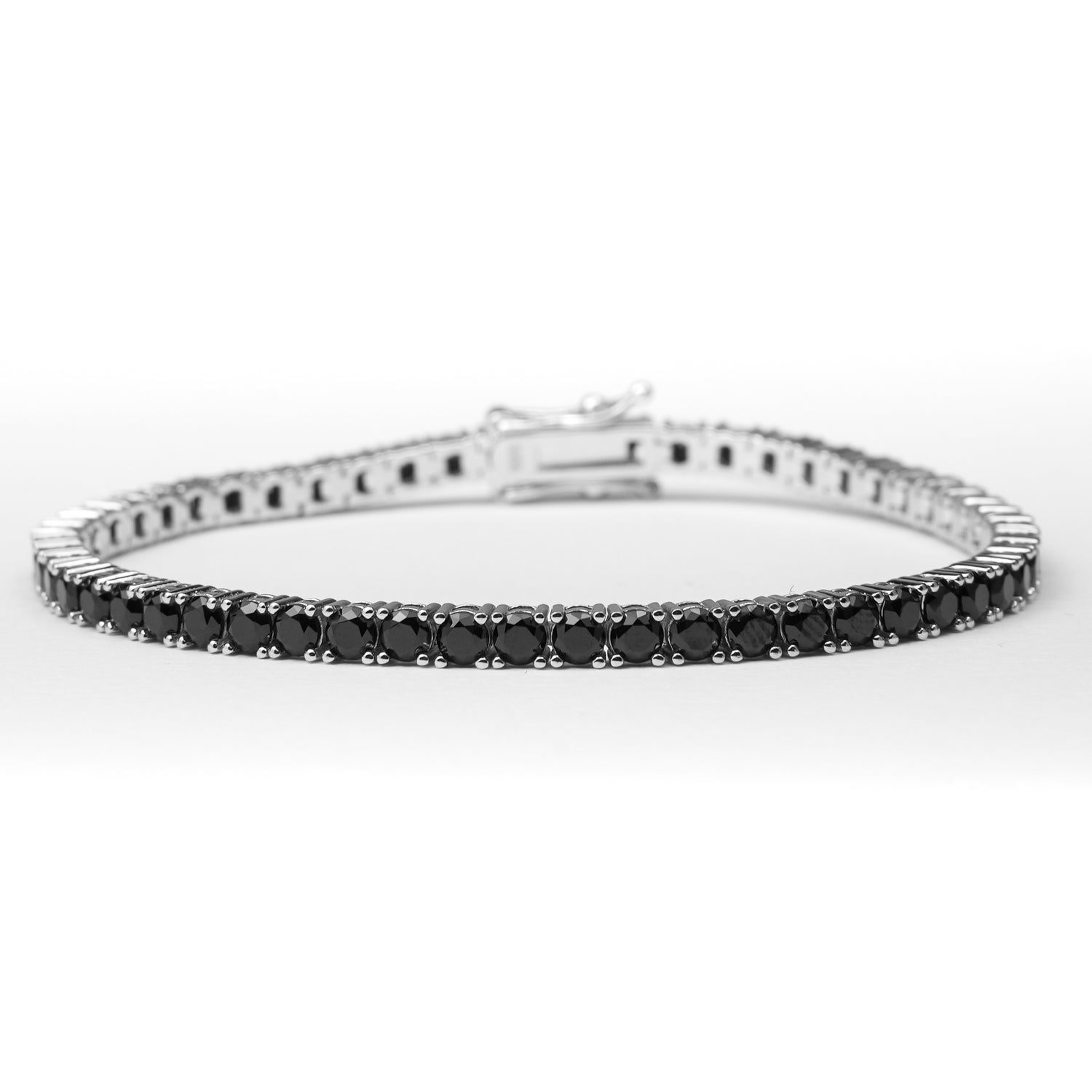 The Black Stone Tennis Bracelet is a bold and elegant accessory crafted from fine silver and shimmering zircon stones.