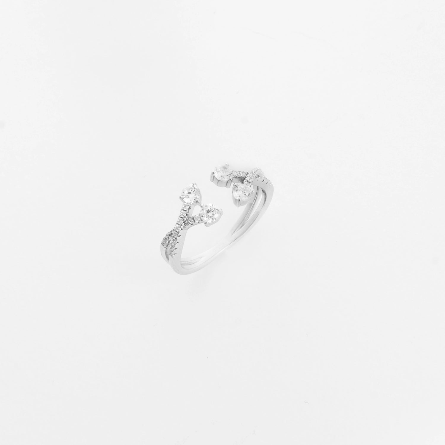 The Branch Blossom Silver Ring features a graceful open-band style with branches tipped in bright zircon stones.