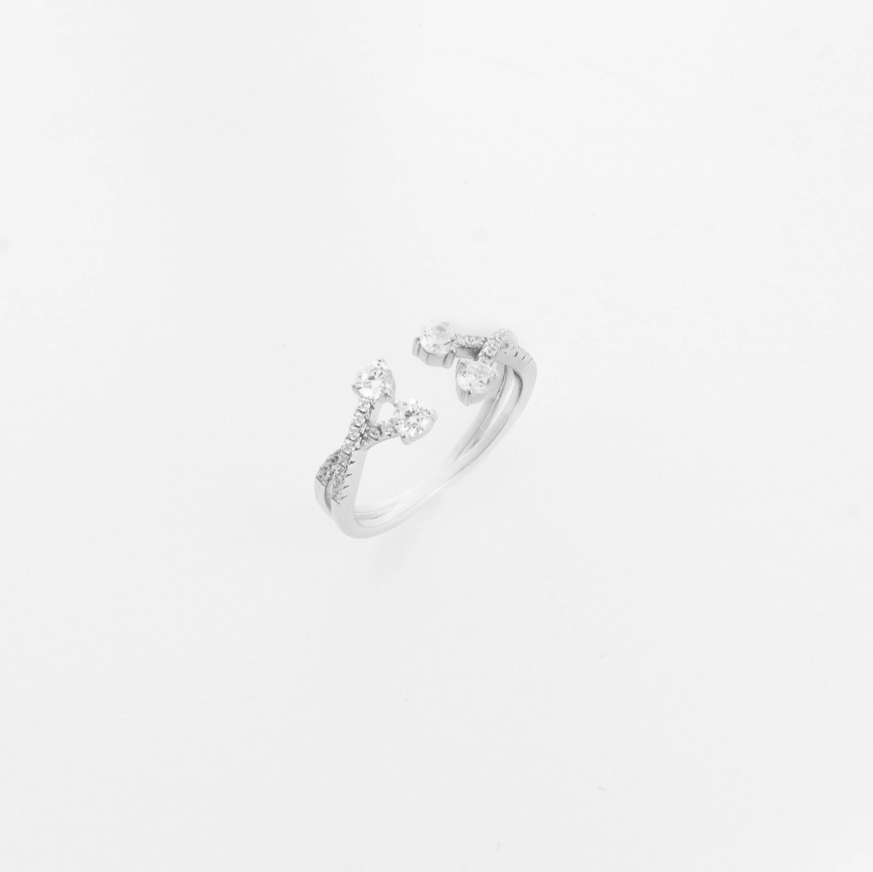 The Branch Blossom Silver Ring features a graceful open-band style with branches tipped in bright zircon stones.