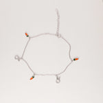 Playful, fresh, and made for sunshine days. The Carrot Bunny Anklet features a fine silver chain with tiny orange carrot charms and adorable crystal-studded bunny heads.