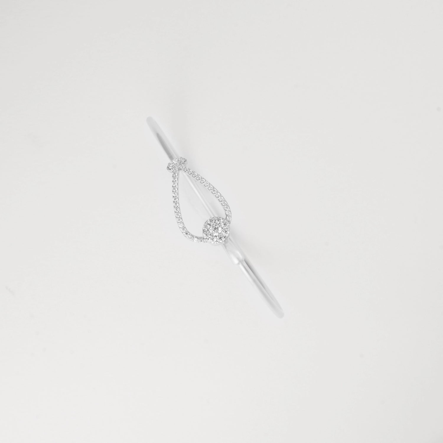 Delicate Crystal Drop Silver Bangle that adds a touch of elegance to any outfit. This versatile bracelet catches the light beautifully, creating subtle sparkle with every movement.