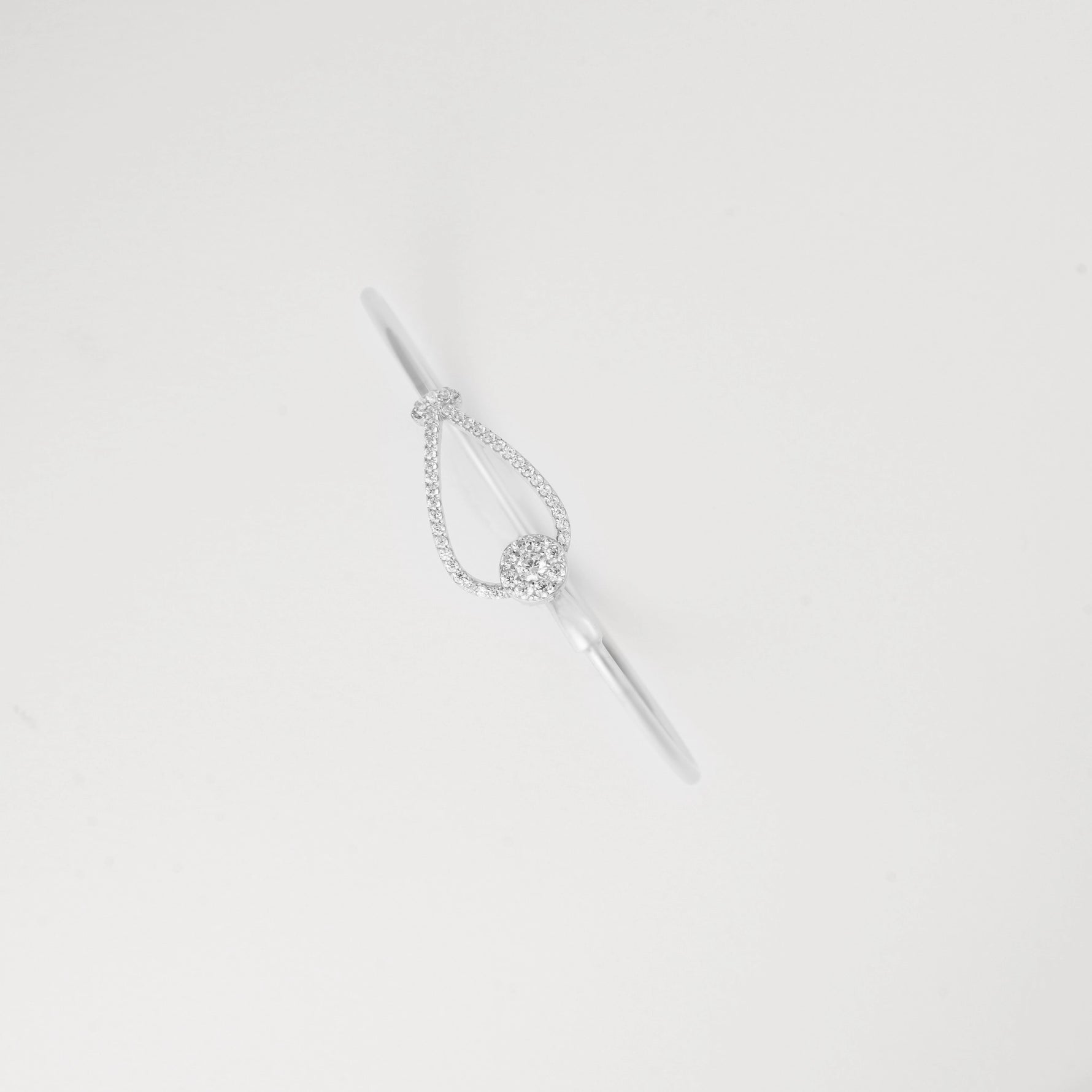 Delicate Crystal Drop Silver Bangle that adds a touch of elegance to any outfit. This versatile bracelet catches the light beautifully, creating subtle sparkle with every movement.