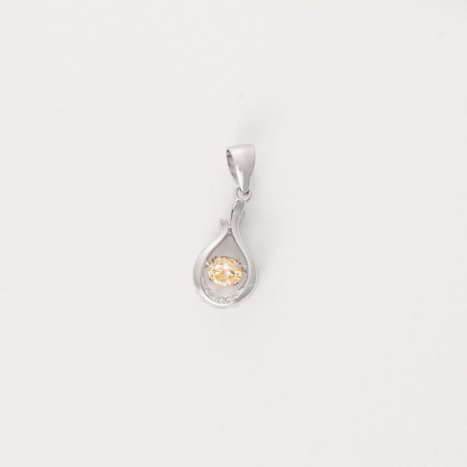 Graceful and glowing, the Crystal Twist Pendant features a soft teardrop shape in fine silver, gently twisted around a radiant crystal.