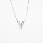Bold yet minimal, the Double V Pendant Necklace brings effortless edge to your look. Crafted in pure silver, it features a sharp V-shape lined with bright zircon stones that add a clean sparkle.