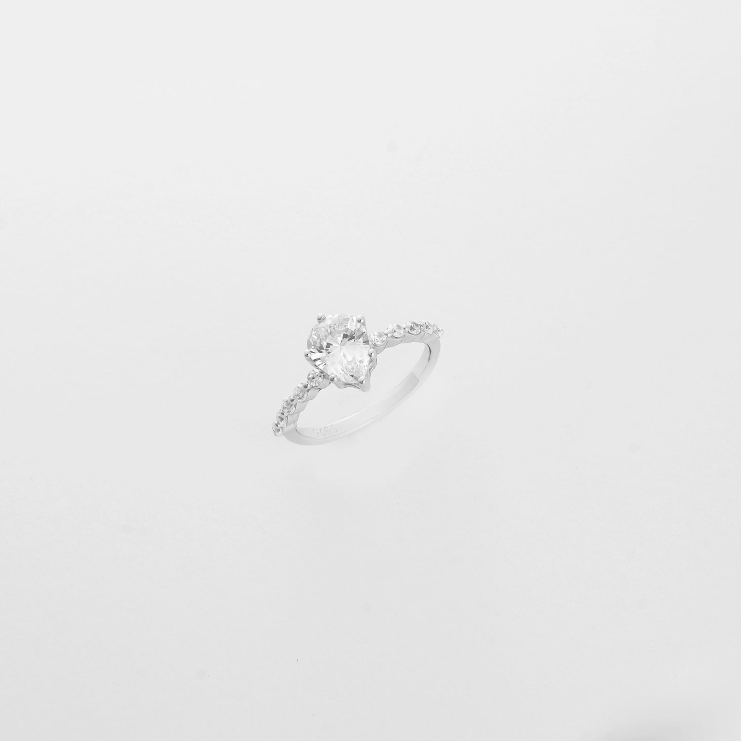 Silver solitaire ring. Crystal stone with zircon on the sides 