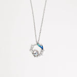 The Mermaid Pearl Necklace captures the enchanting beauty of the sea. Crafted from fine silver and sparkling zircon stones, it features a delicate circular design with a shimmering pearl at its heart and a touch of blue enamel that evokes ocean waves.
