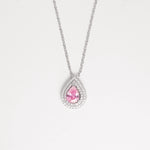 The Pink Drop Stone Necklace is a stunning piece that radiates soft elegance and feminine charm. Crafted from fine silver and surrounded by sparkling zircon stones, its delicate pink centerpiece captures the light beautifully.