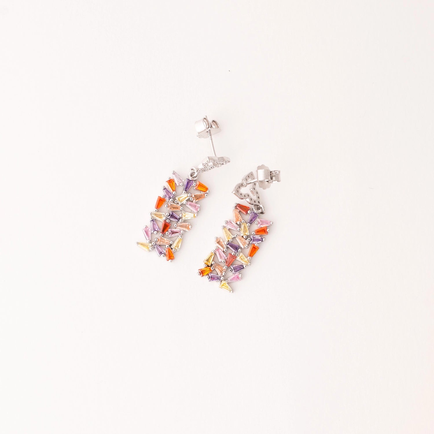 Add a pop of color to your style with these Rainbow Shard Earrings. Crafted from fine silver, they feature bright, colorful shards that sparkle with every move.