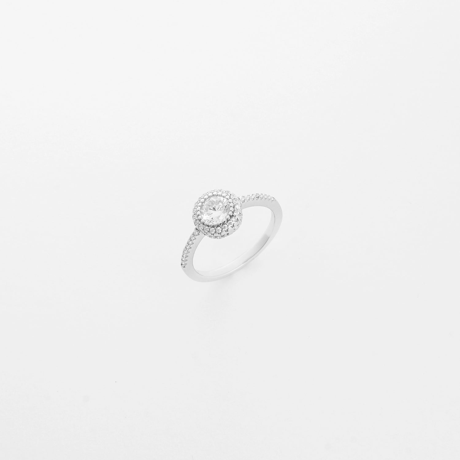 The Halo Glow ring features a round center stone surrounded by a double halo of bright zircon stones, all set in solid silver.